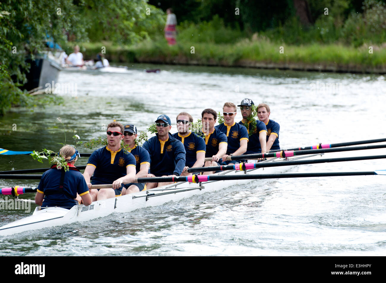 Cambridge May Bumps, a Wolfson College men`s eight wearing twigs after achieving a bump. Stock Photo